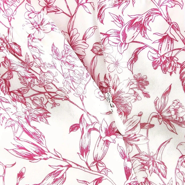 Ortagus - שמלה פרחונית עם רפלים